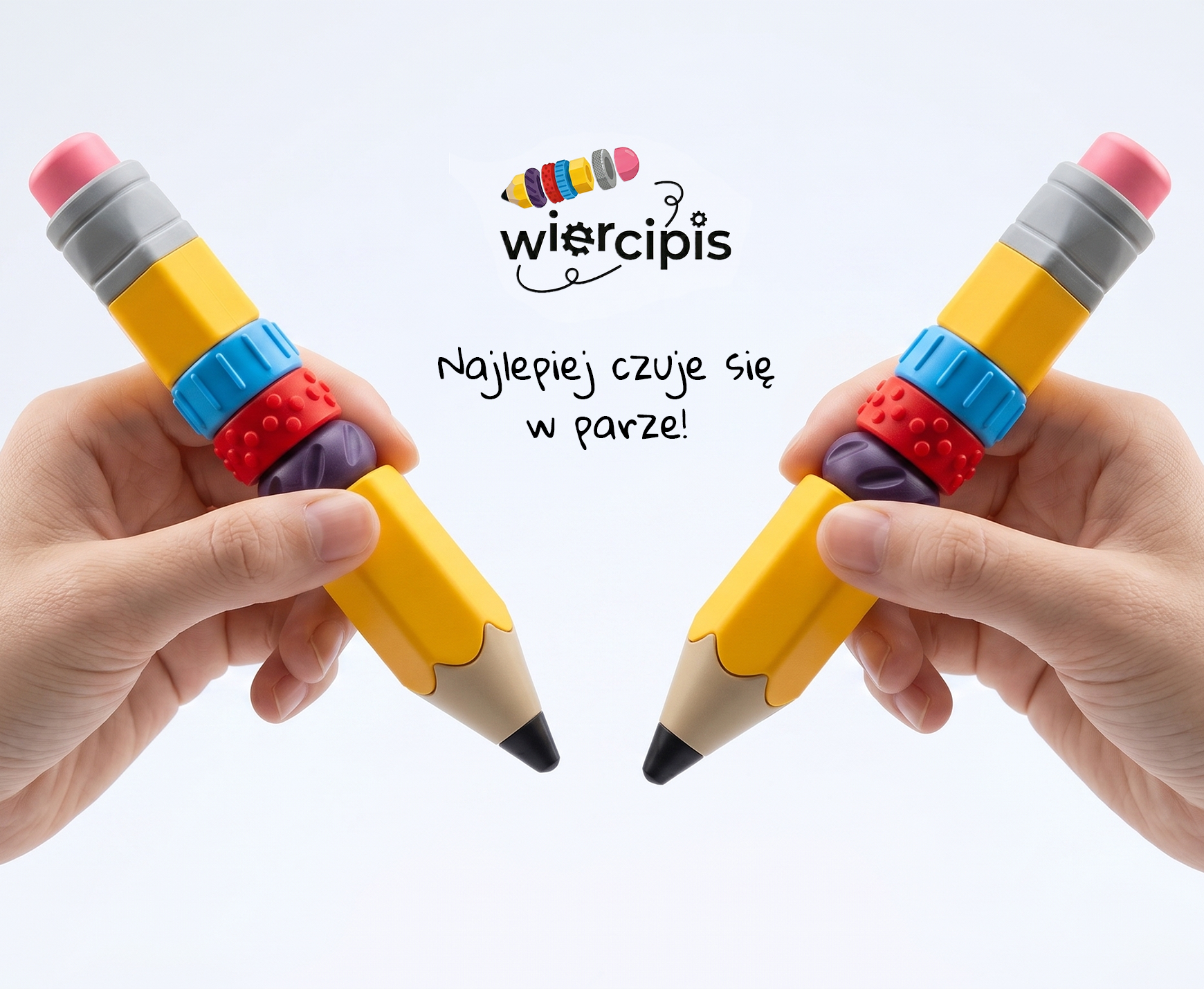 Dwie dłonie trzymające modułowe długopisy antystresowe Wiercipis oraz logo z napisem: Najlepiej czuje się w parze!